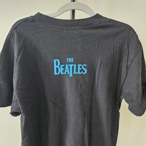 The Beatles.  T-SHIRT. Size M  Black, with the graphic in multiple colors.
